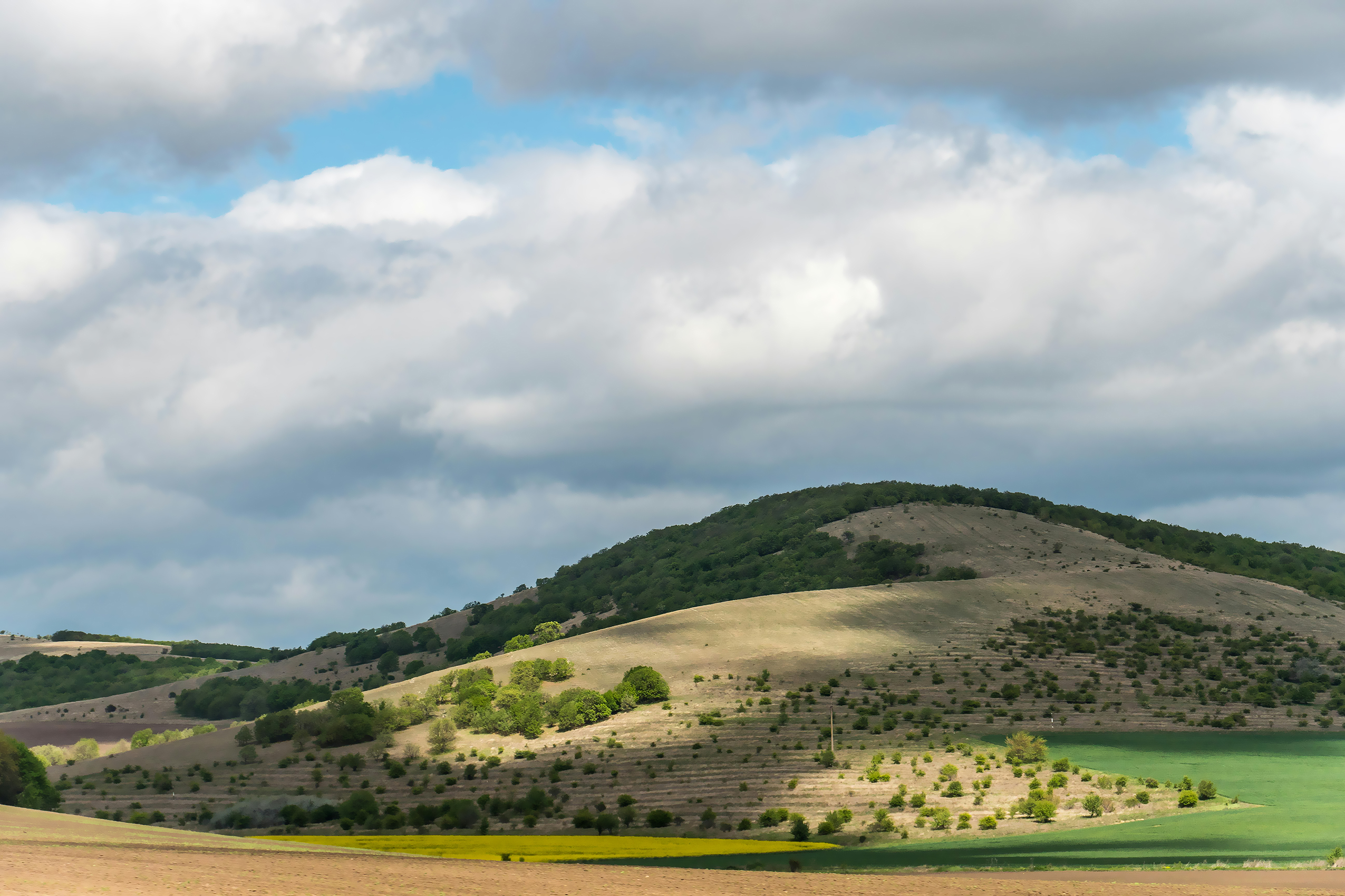 Hills Under Cloudy Skies